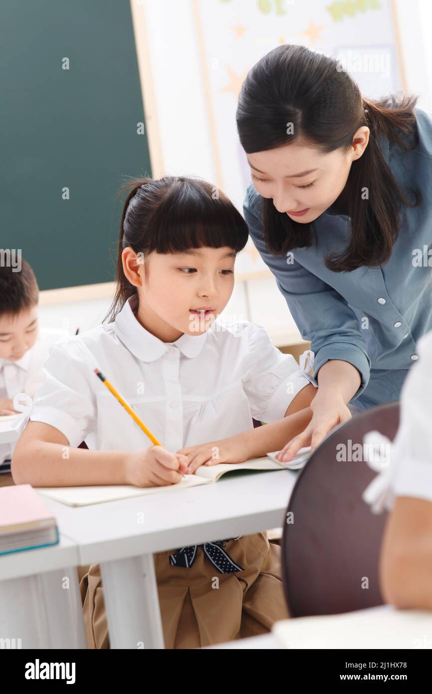 The teachers and pupils are in the classroom Stock Photo - Alamy