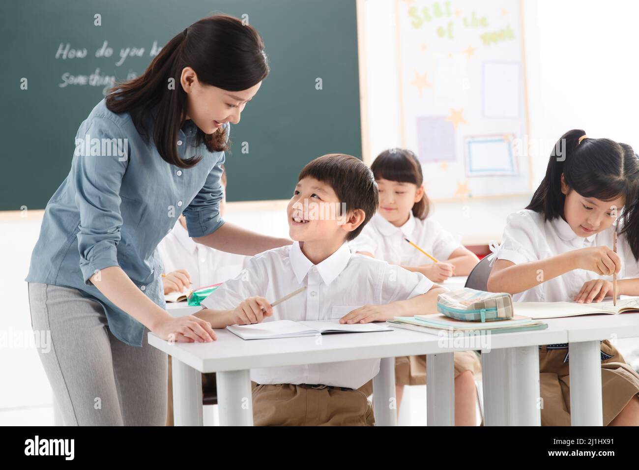 The teachers and pupils are in the classroom Stock Photo - Alamy