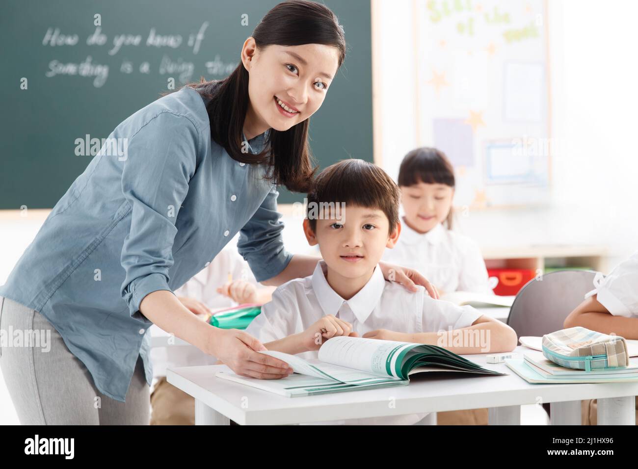 The teachers and pupils are in the classroom Stock Photo - Alamy