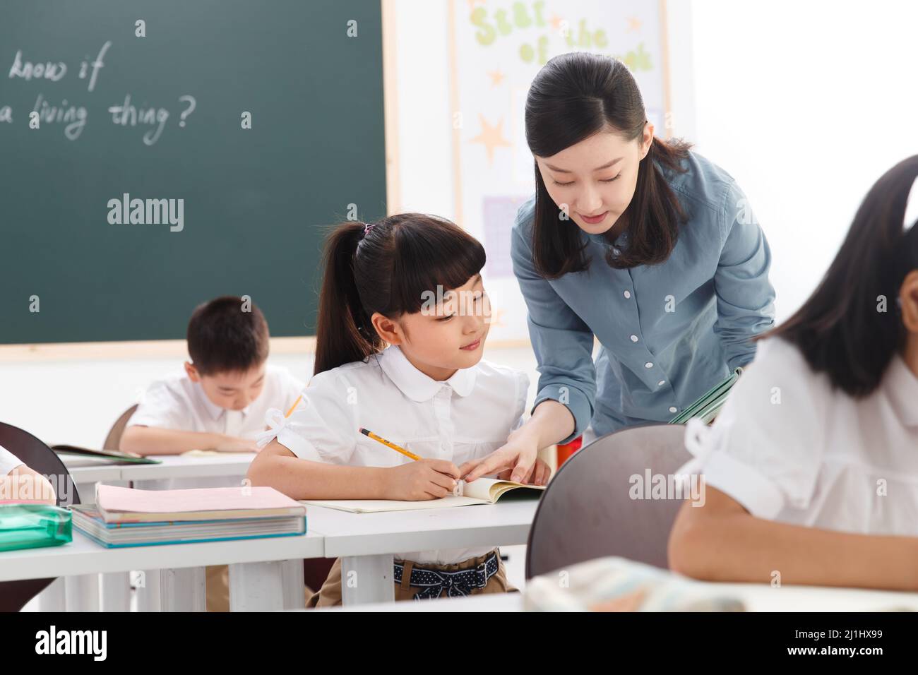 The teachers and pupils are in the classroom Stock Photo - Alamy