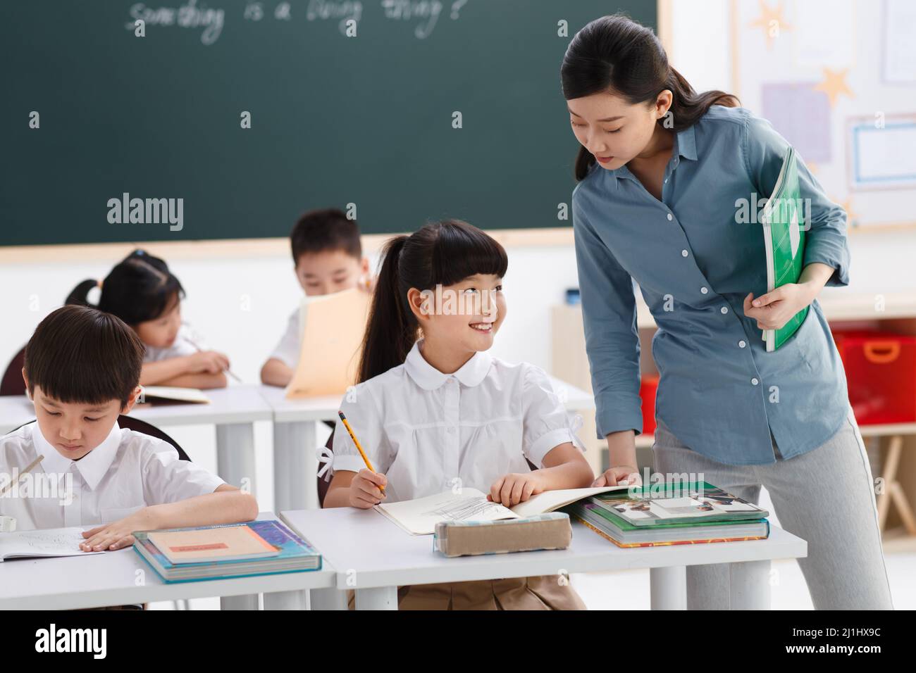 The teachers and pupils are in the classroom Stock Photo - Alamy