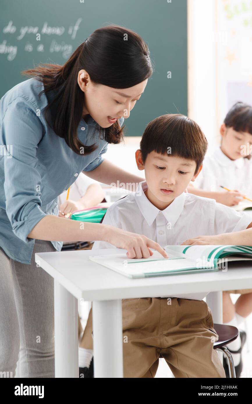 The teachers and pupils are in the classroom Stock Photo - Alamy
