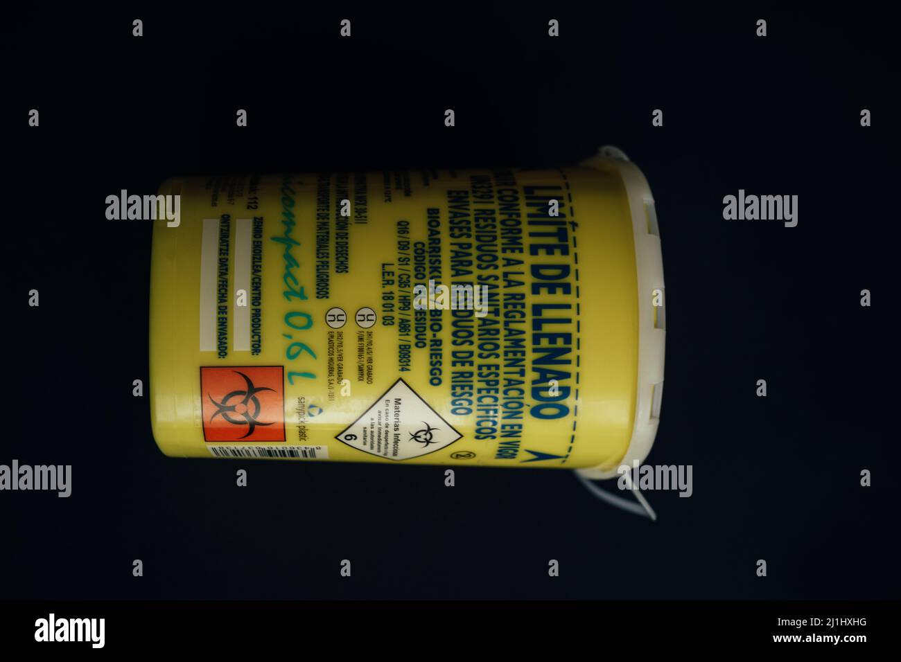 yellow container for used syringes and needles isolated Stock Photo Alamy