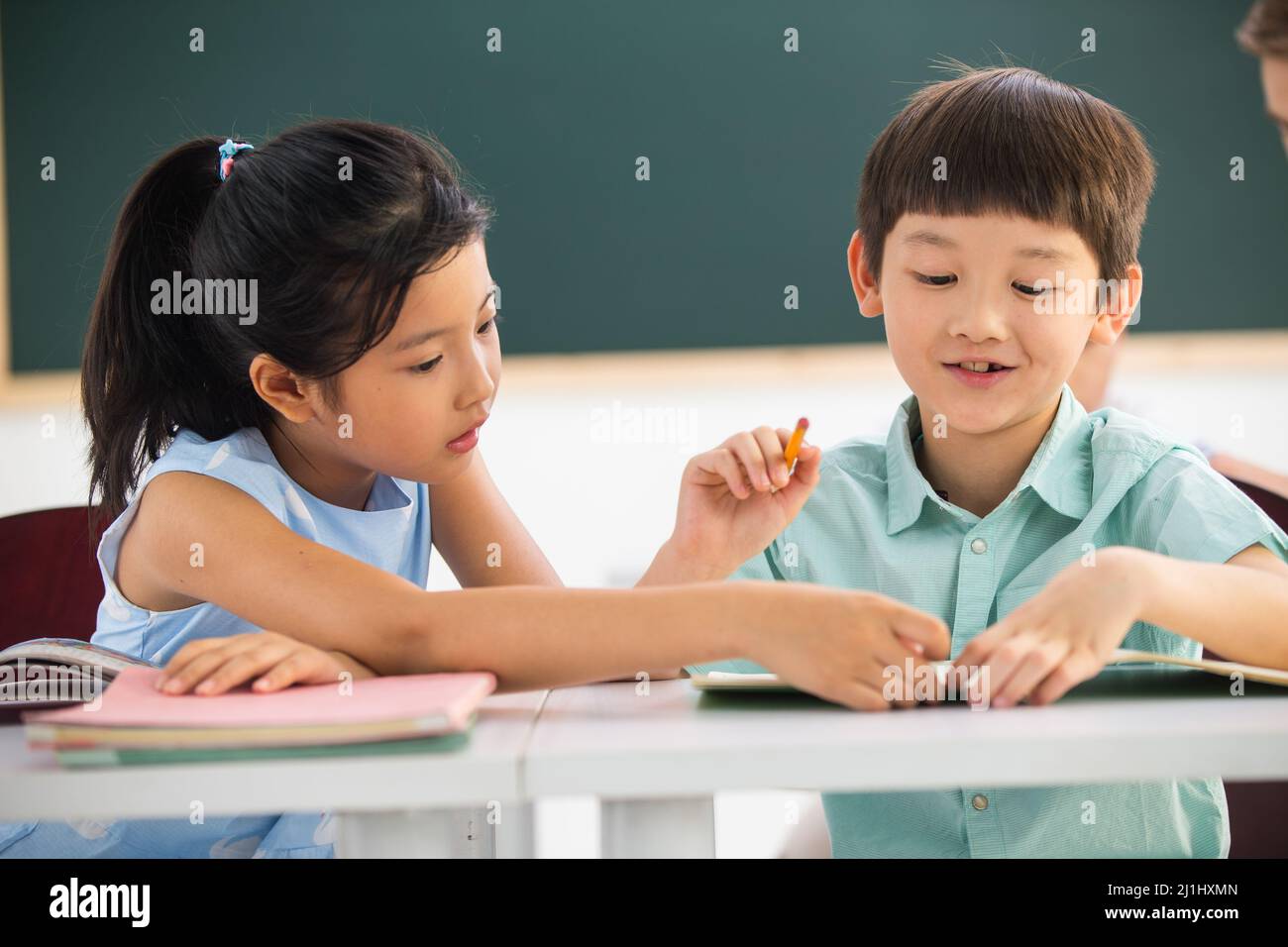 Elementary school students in the classroom learning Stock Photo
