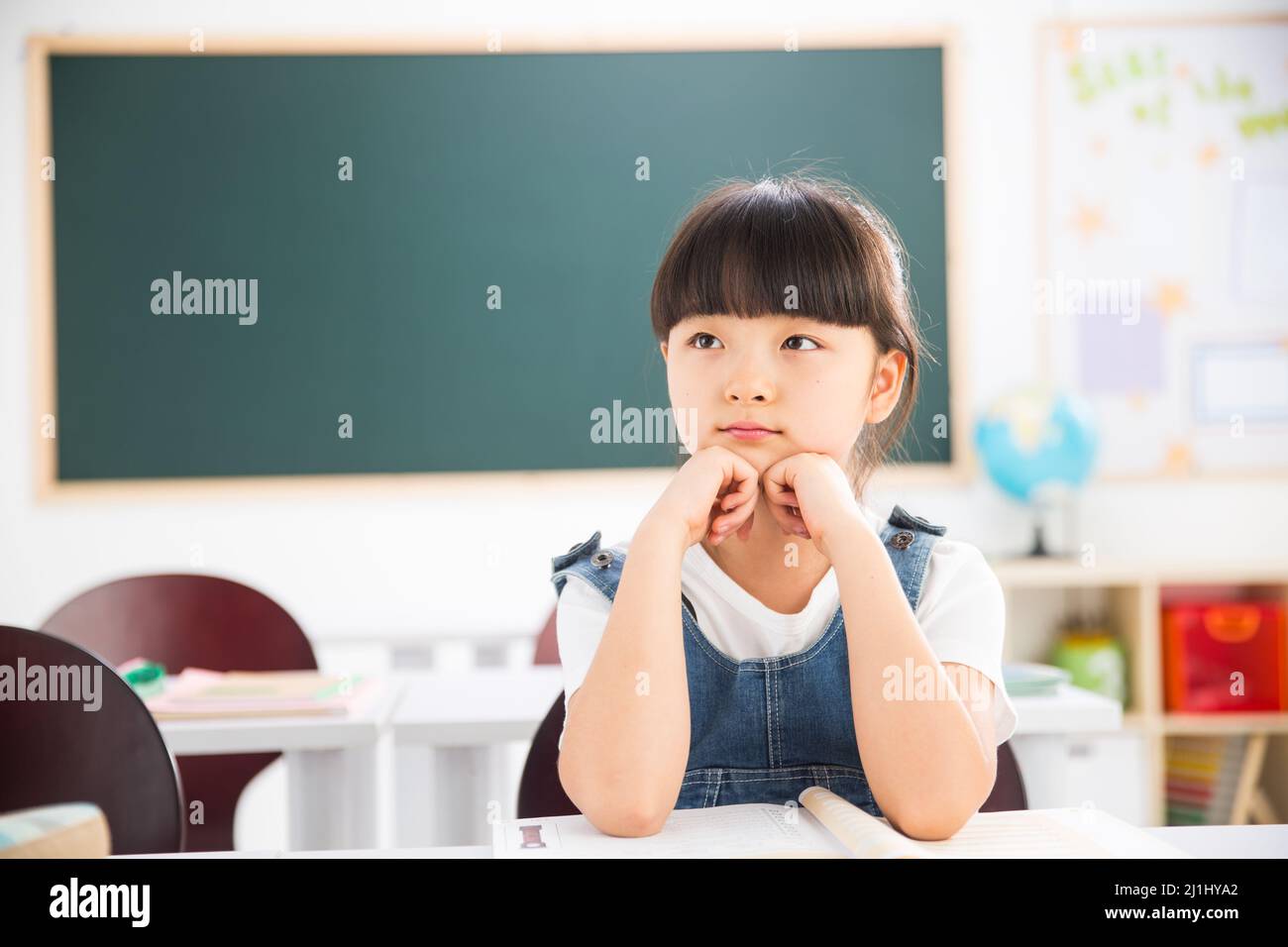 Primary school girls in the classroom Stock Photo - Alamy