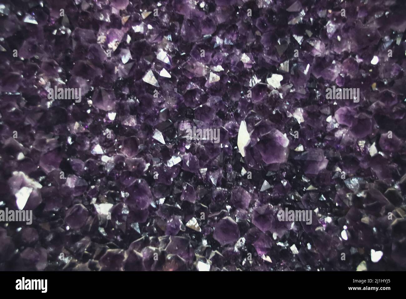Raw amethyst stone texture background Stock Photo