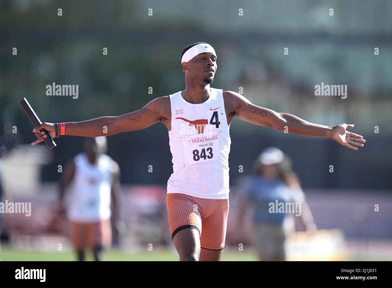 Jonathan Jones celebrates after running the anchor leg on the Texas