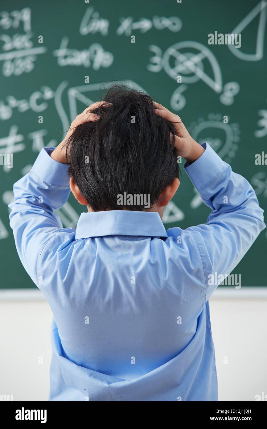 The back of elementary school boys were math problem difficult Stock ...