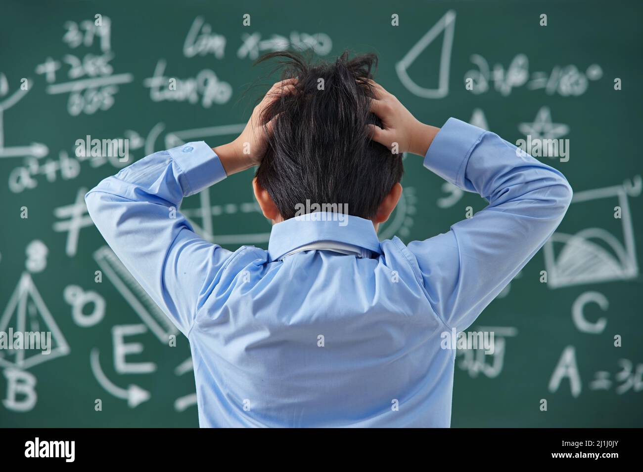 The back of elementary school boys were math problem difficult Stock ...