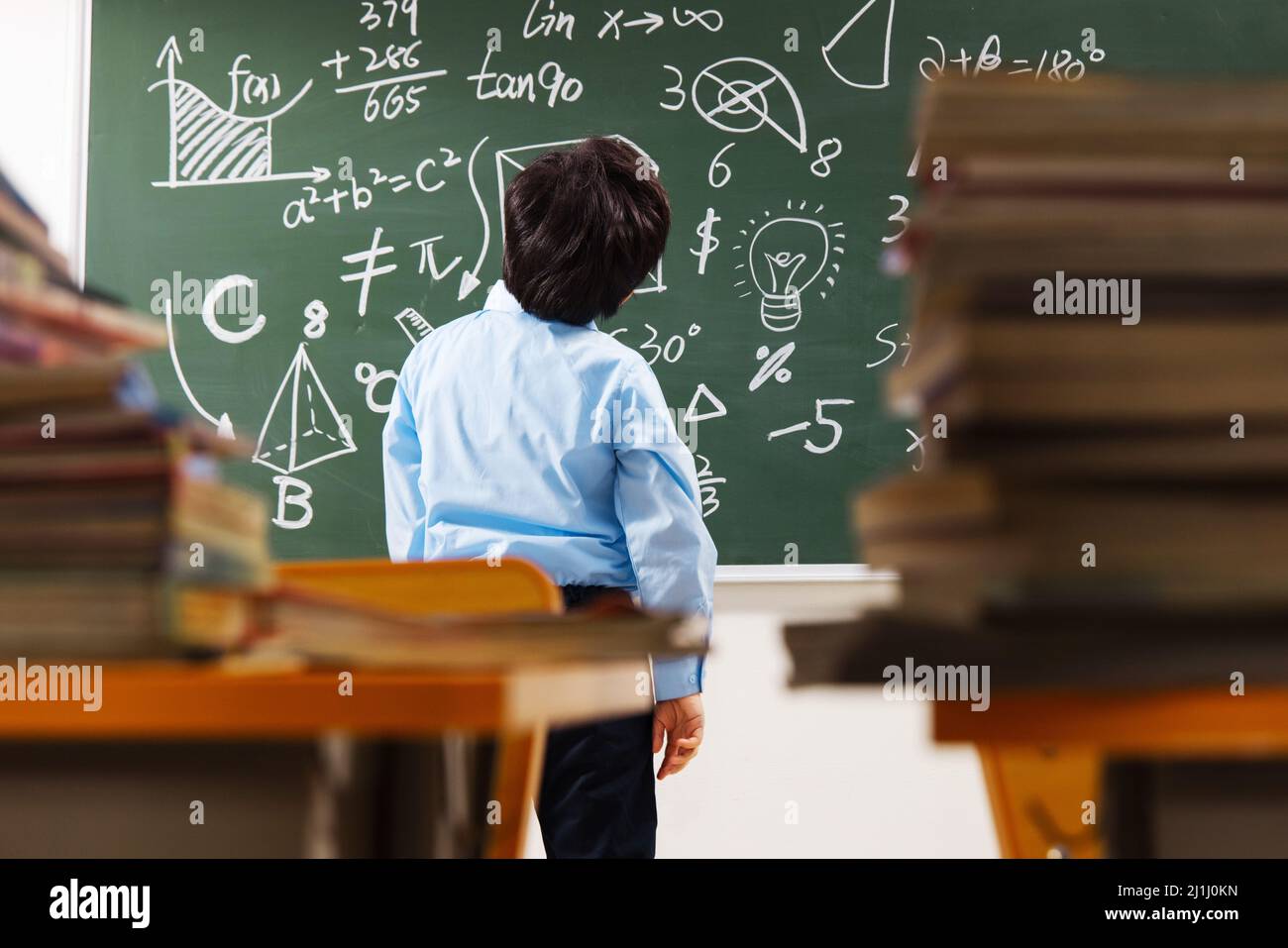 The Boy Problem The back of elementary school boys were math problem difficult Stock ...