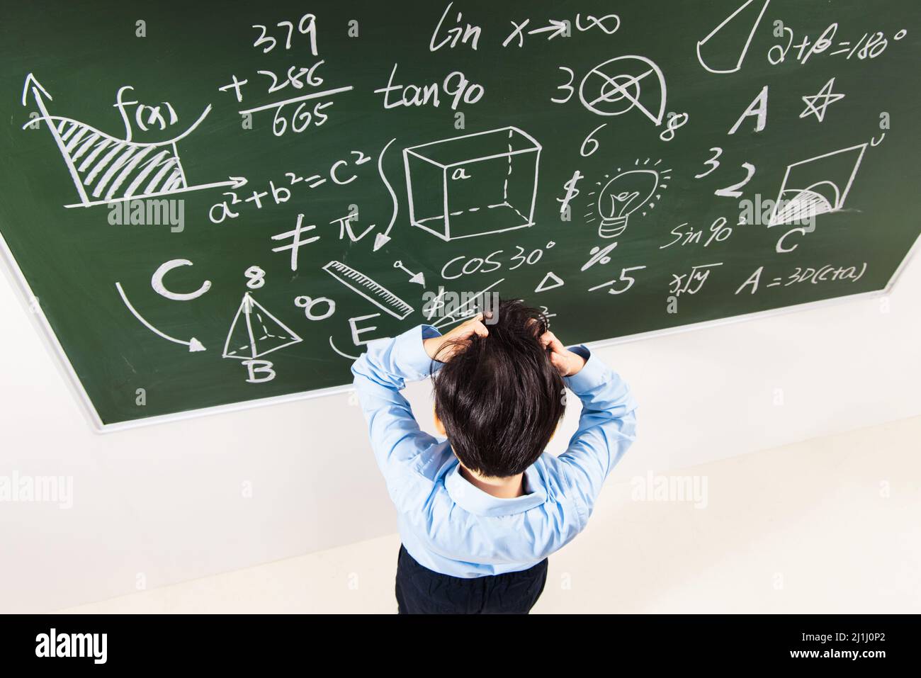 The back of elementary school boys were math problem difficult Stock ...