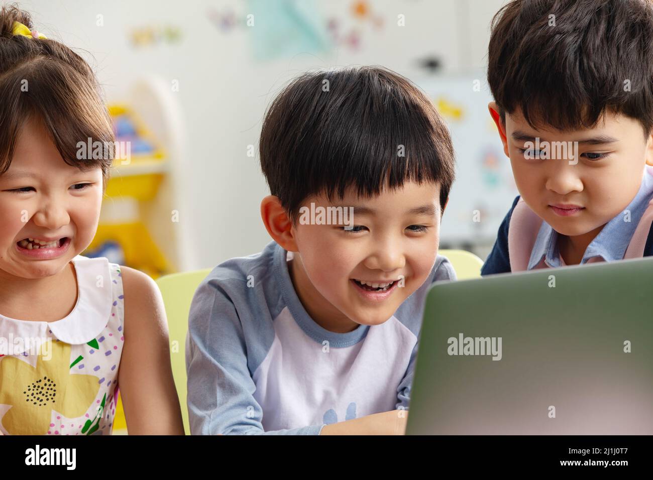 The kindergarten children watch video Stock Photo - Alamy