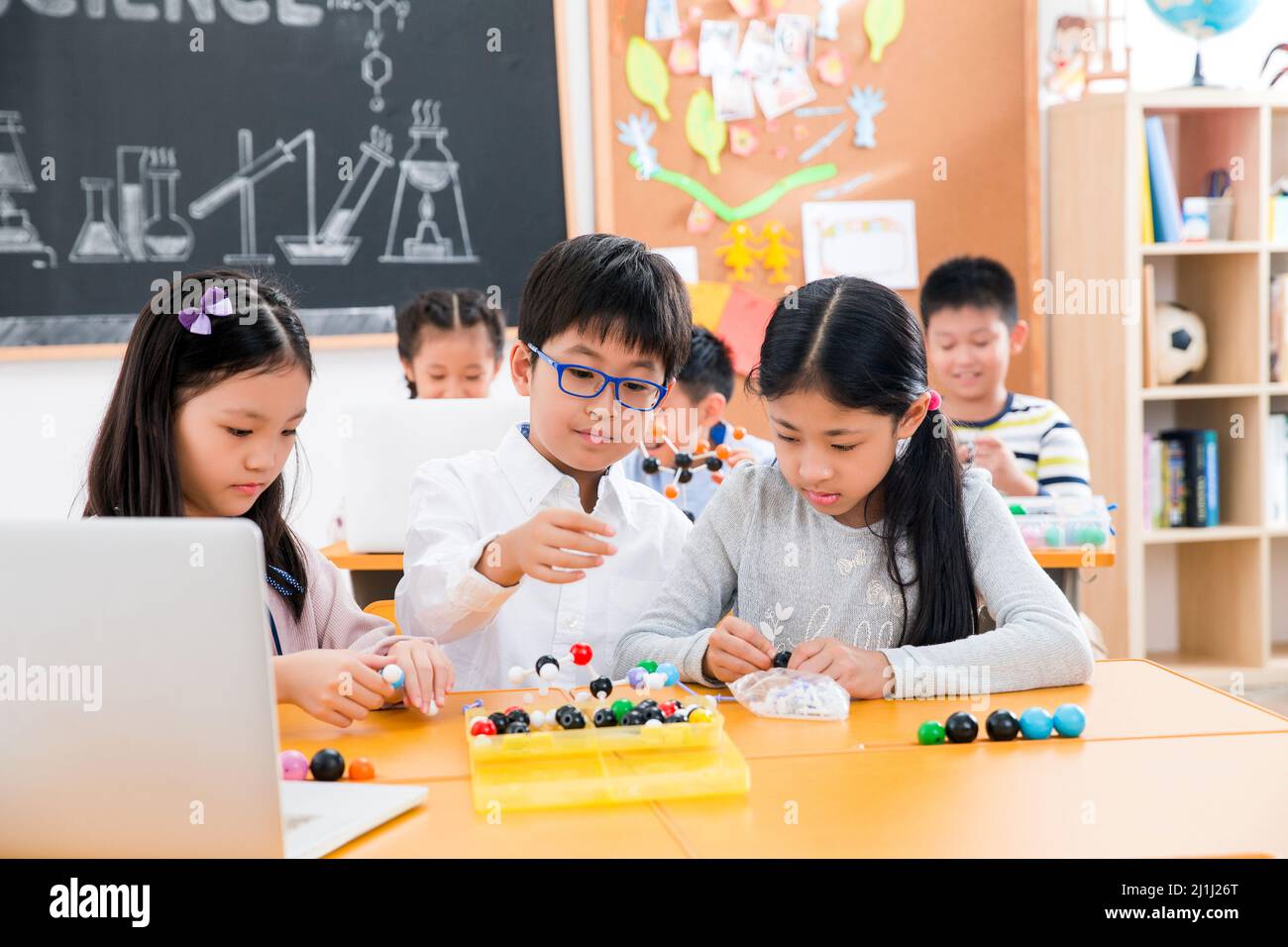 Elementary school students use computers in the classroom Stock Photo ...