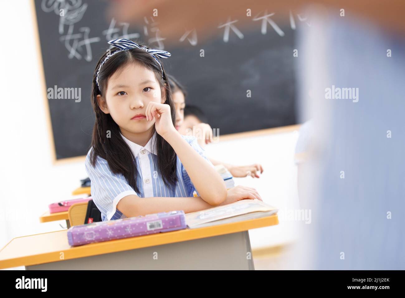 Primary school girls in the classroom Stock Photo - Alamy