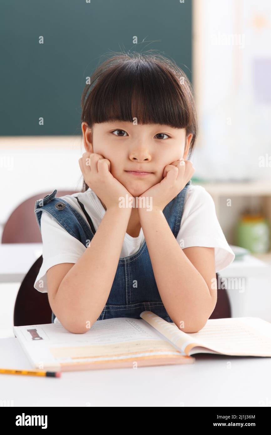 Primary school girls in the classroom Stock Photo - Alamy