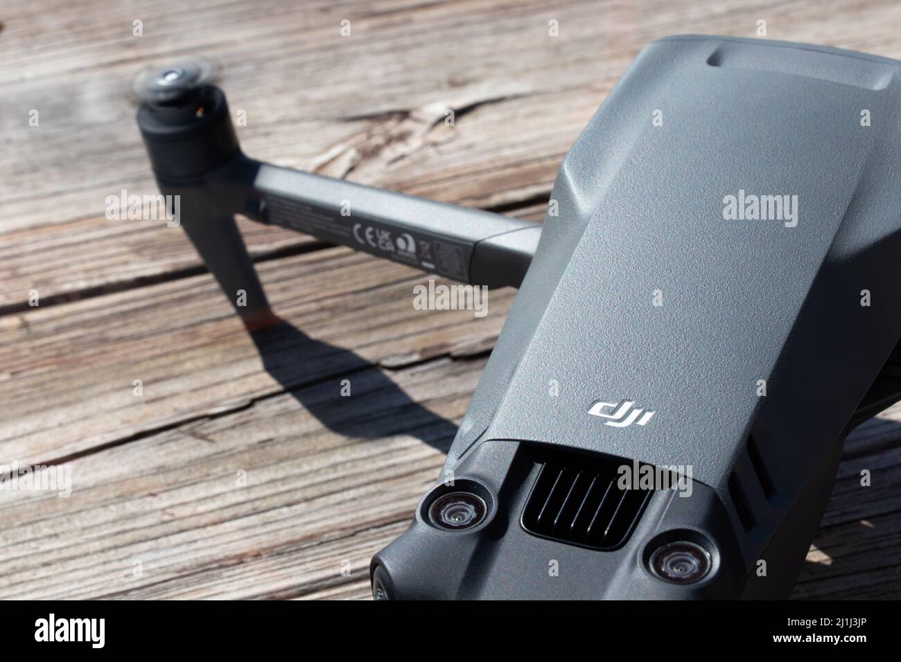 The DJI logo, a Chinese technology company and popular drone manufacturer is seen on the top of the new DJI Mavic 3 consumer drone. Stock Photo