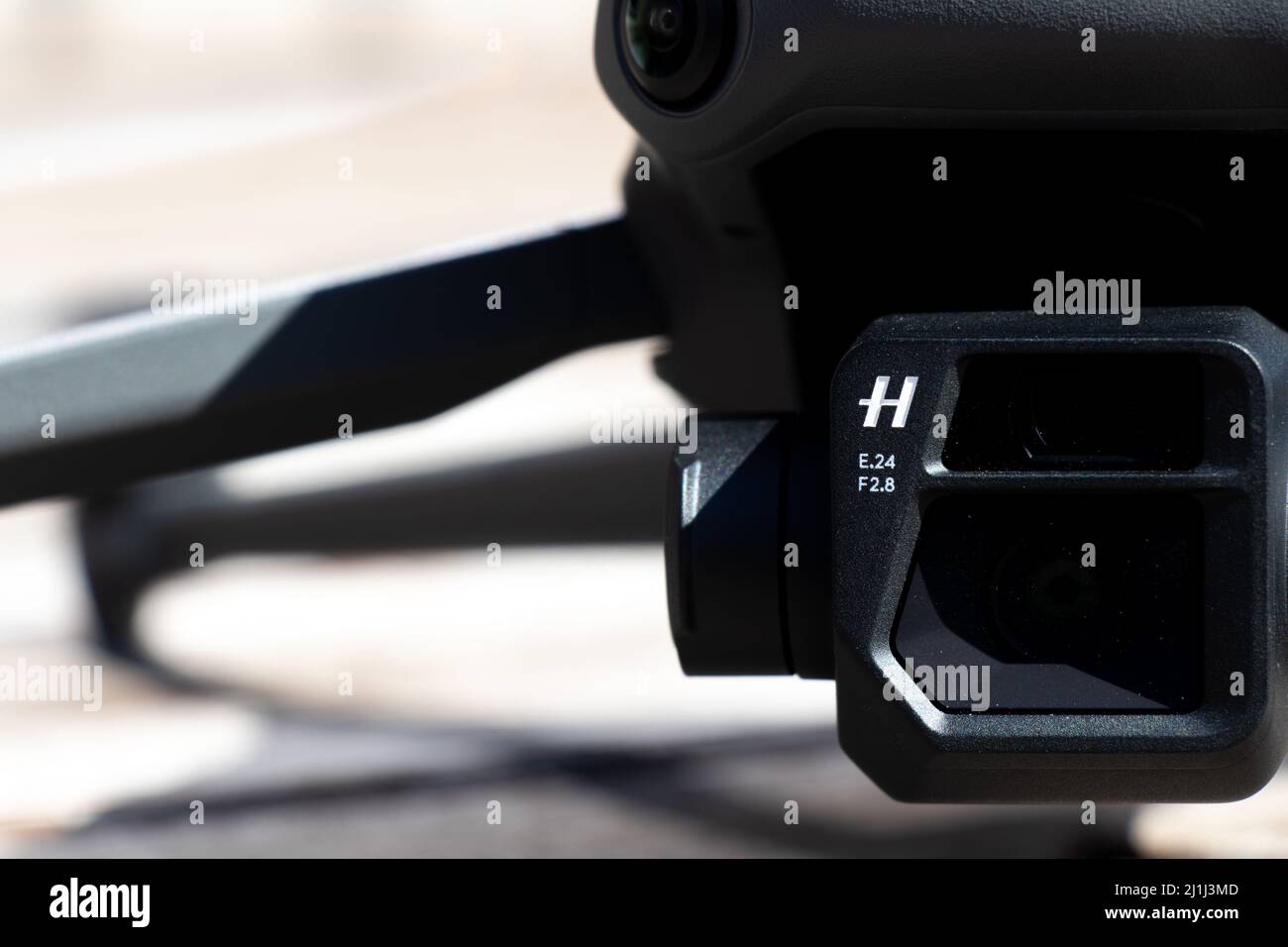 A close-up view of the Hasselblad logo on the front of the camera for the DJI Mavic 3, a high-tech, popular consumer drone. Stock Photo