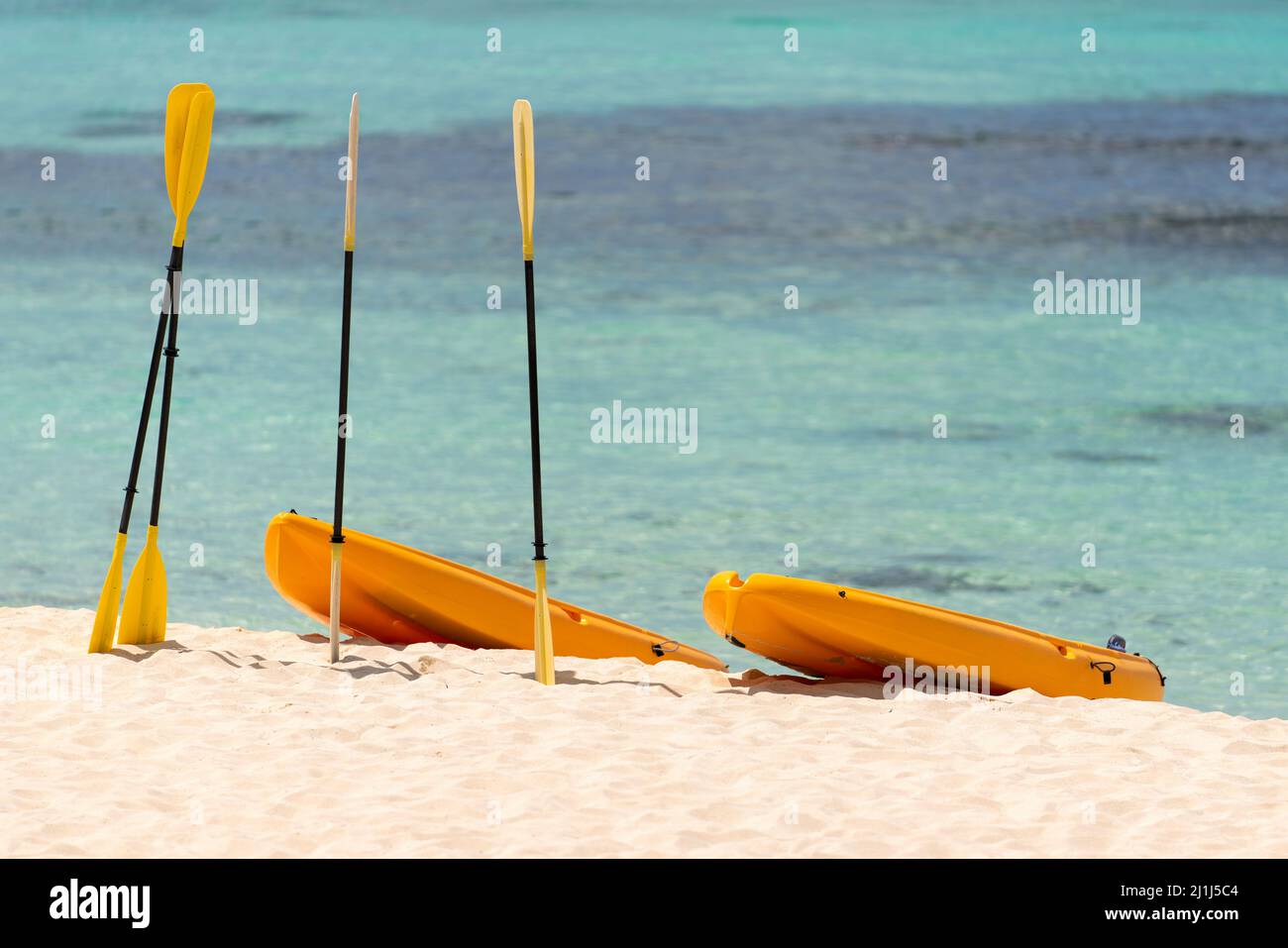 Orange boats with oars on the sandy shore. Beautiful seascape on the Caribbean Sea in the Dominican Republic. High quality photo Stock Photo