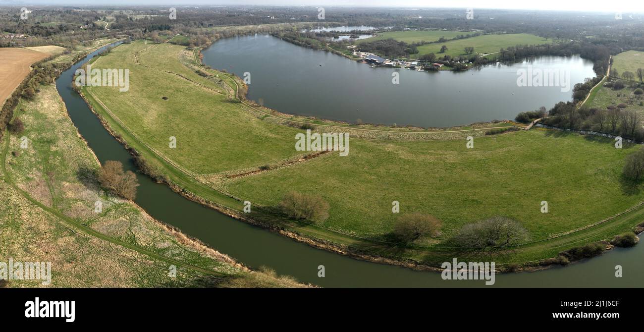 Peterborough, UK. 25th Mar, 2022. A panorama picture of Ferry Meadows in Peterborough, Cambridgeshire, UK. The River Nene leading from Castor to Milton Ferry (top left), with Gunwade Lake in front of the Watersports Centre at Ferry Meadows, Nene Park. Credit: Paul Marriott/Alamy Live News Stock Photo
