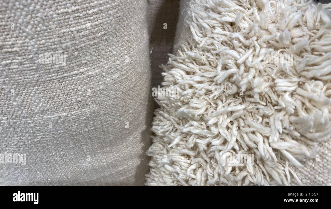 The texture of the carpet for the house is made of natural material. Long-pile fabric. Natural linen color Stock Photo