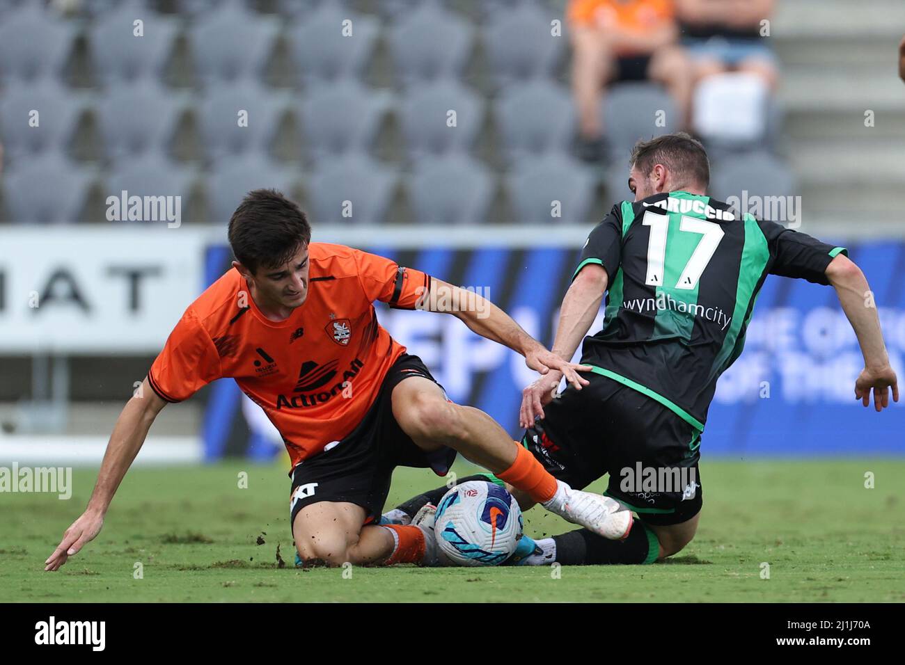 Redcliffe, Australia. 26th Mar, 2022. Luke Ivanovic of the Roar is fouled by Benjamin Garuccio of the Western Pride Credit: News Images /Alamy Live News Stock Photo