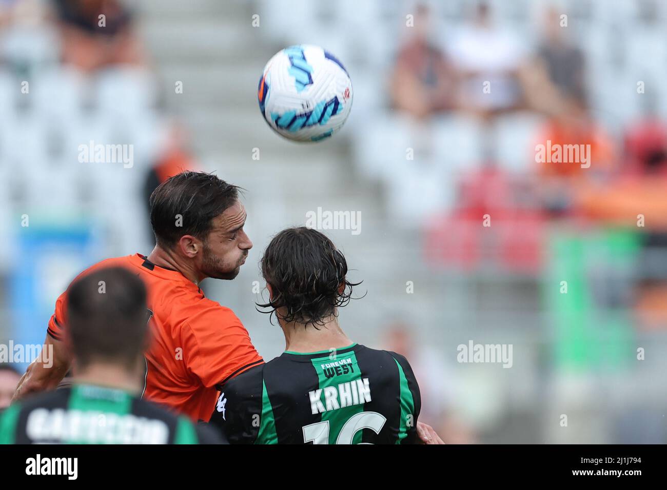 Redcliffe, Australia. 26th Mar, 2022. Jack Hingert of the Roar and Rene Krhin of Western United compete for an aerial ball Credit: News Images /Alamy Live News Stock Photo