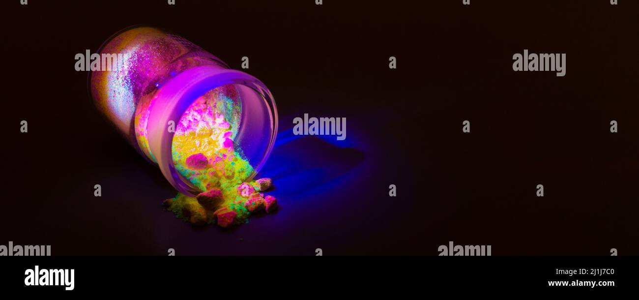 Fluorescent organic materials like a powder of red, yellow and green