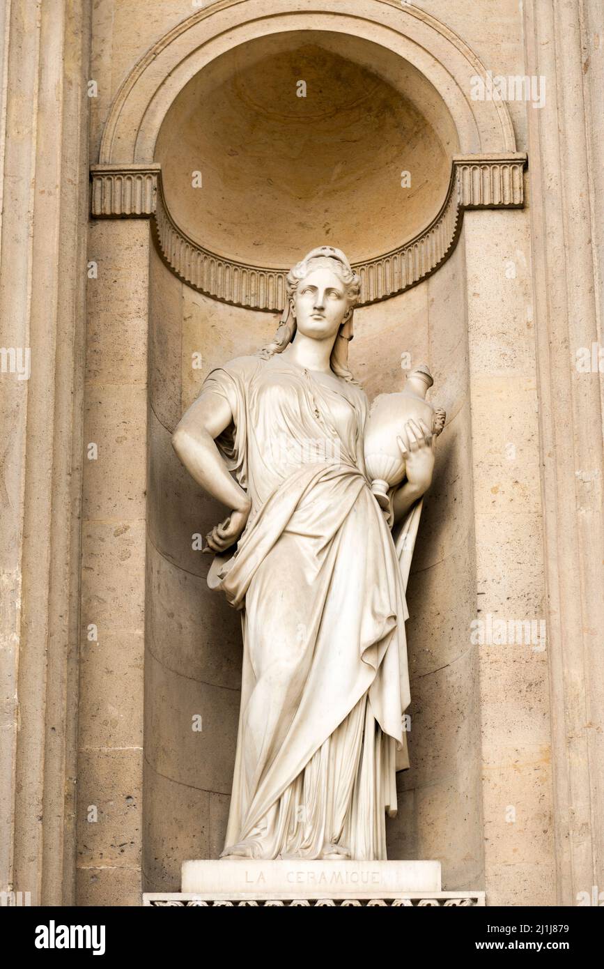 'La Céramique' sculpture by Eugène Guillaume in a niche on the Lemercier wing of the Cour Carrée, Louvre Museum, Paris, France Stock Photo