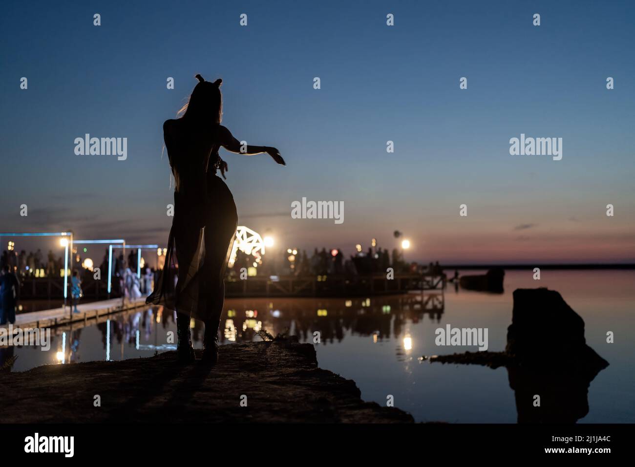 Woman dancing at open air music festival Stock Photo - Alamy