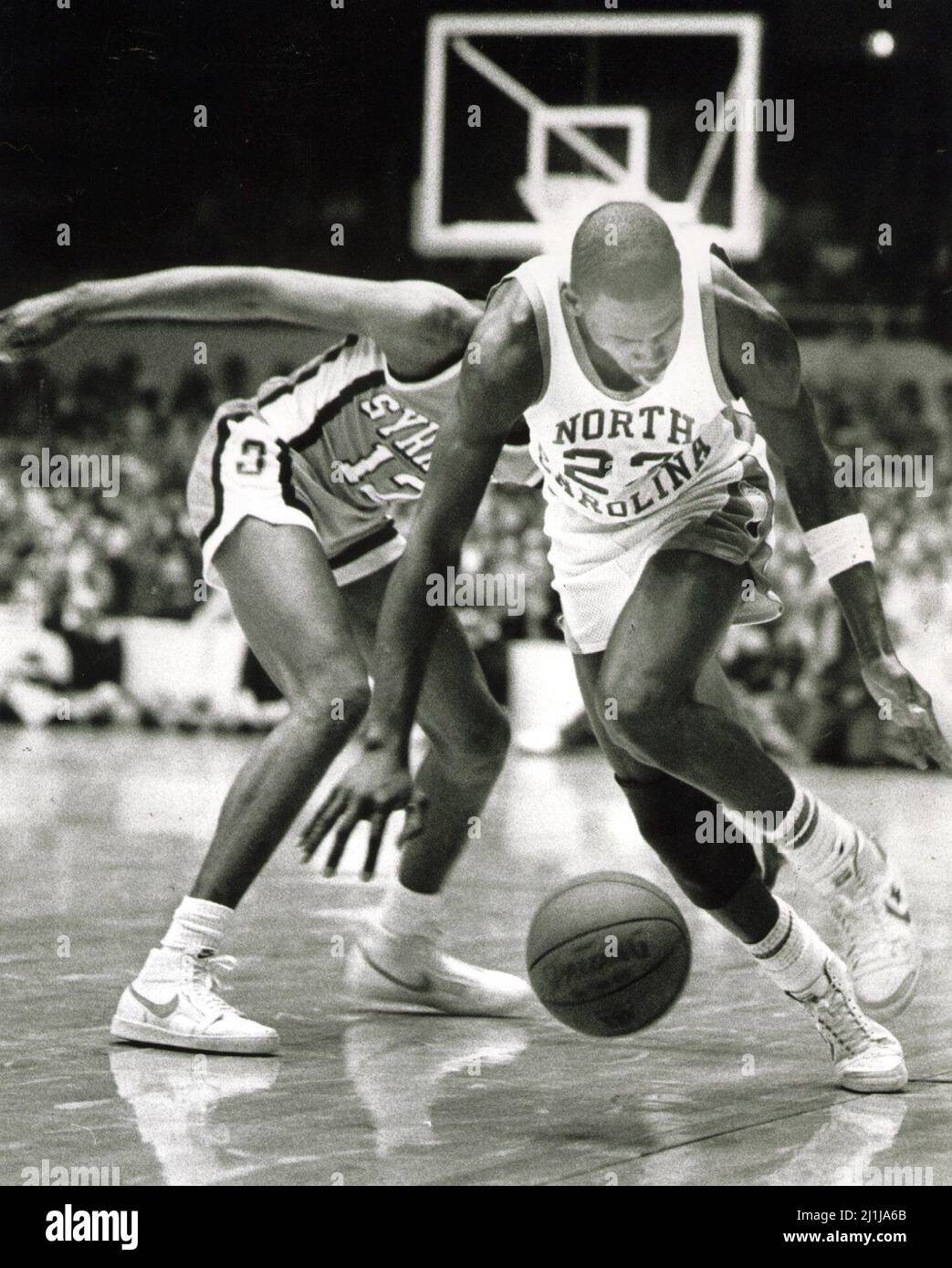 In a February 1983 file image, North Carolinas Michael Jordan, right, chases after a loose ball during a game against Syracuse
