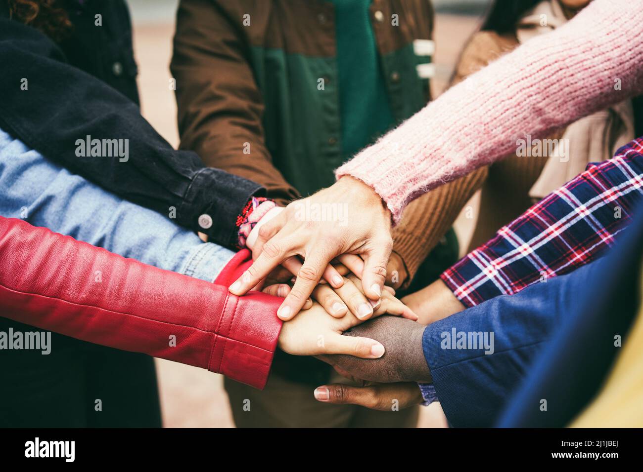 Young group of people stacking hands outdoor - Focus on hands Stock ...