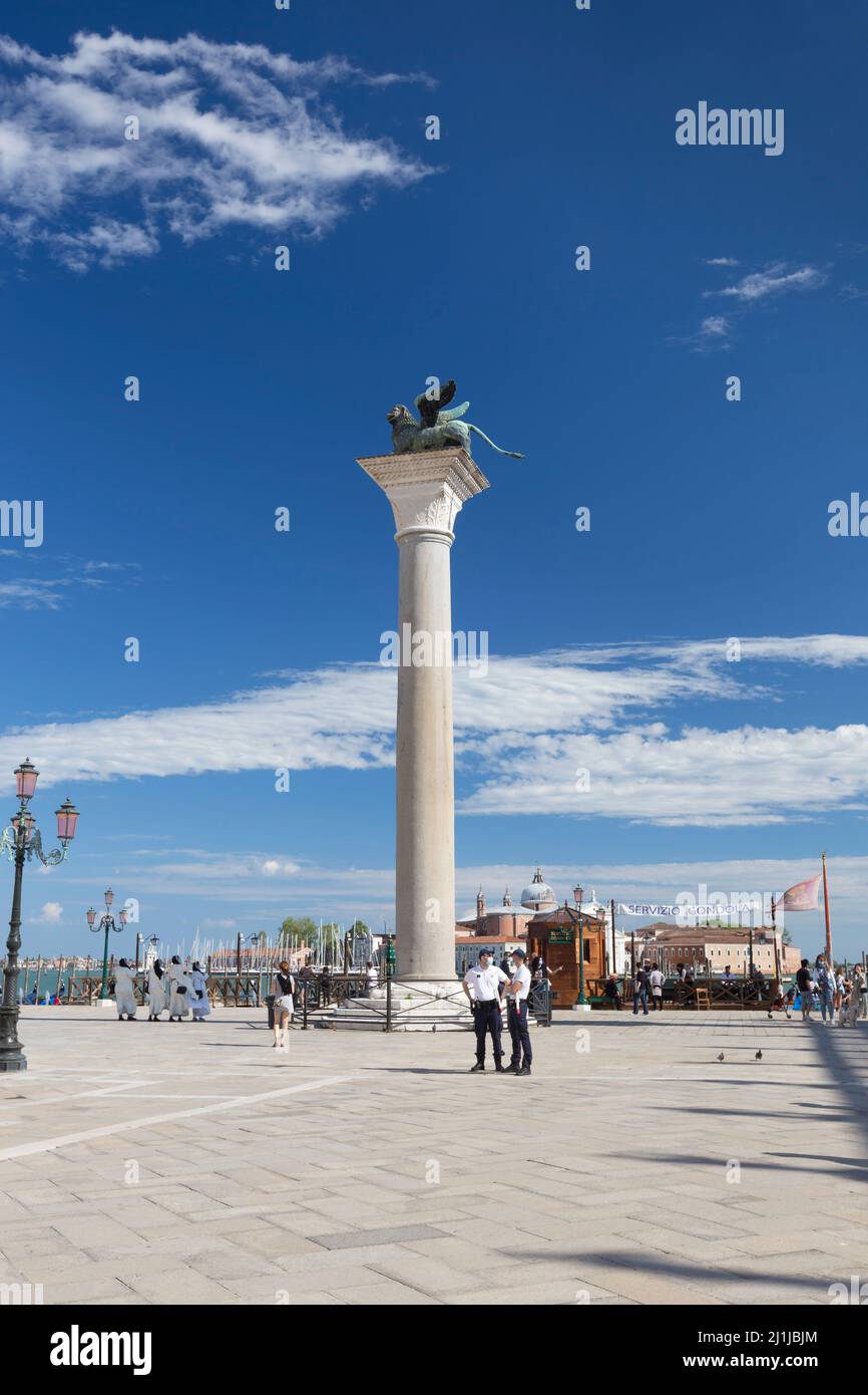 Column bearing a winged lion, symbol of St Mark, san Marco square, Venice, Italy Stock Photo