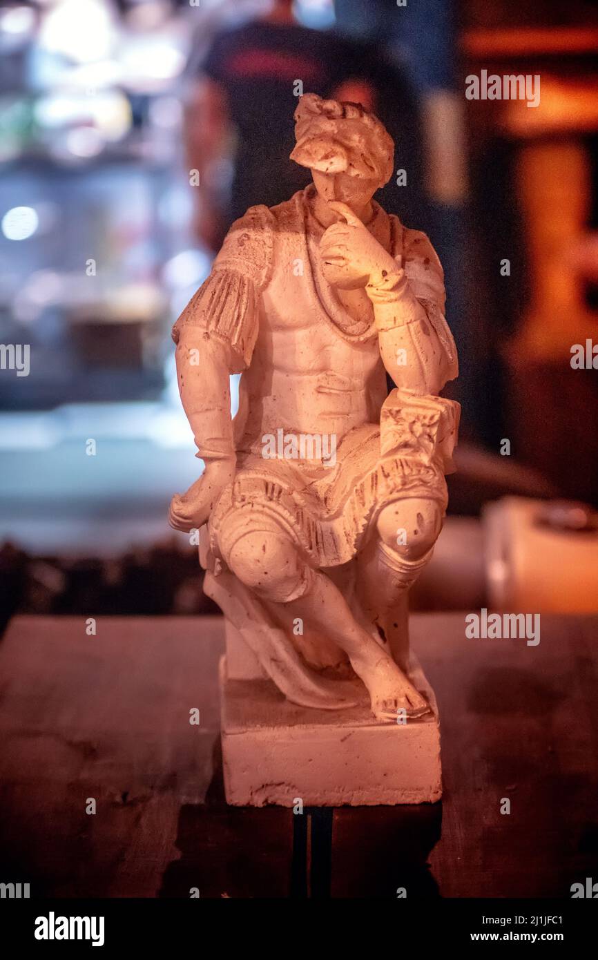 A shallow focus of a sculpture of man thinking, an Original piece of