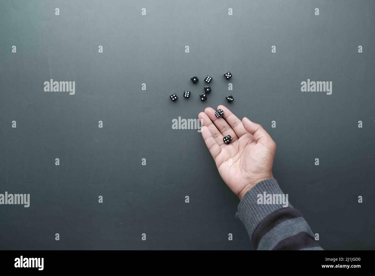 Black Dice trowing on black background top view  Stock Photo