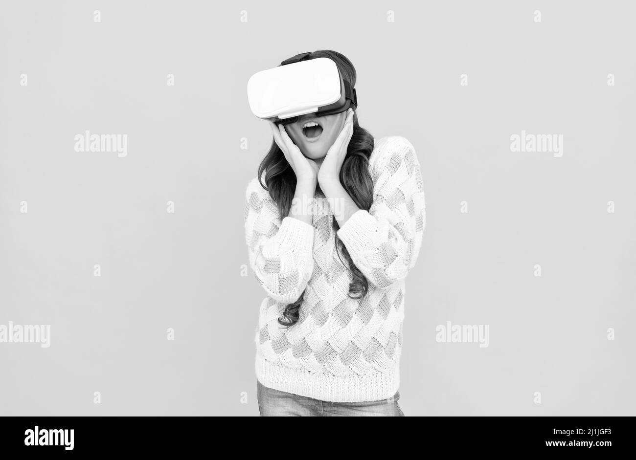 amazed teen girl wear vr glasses using future technology for education