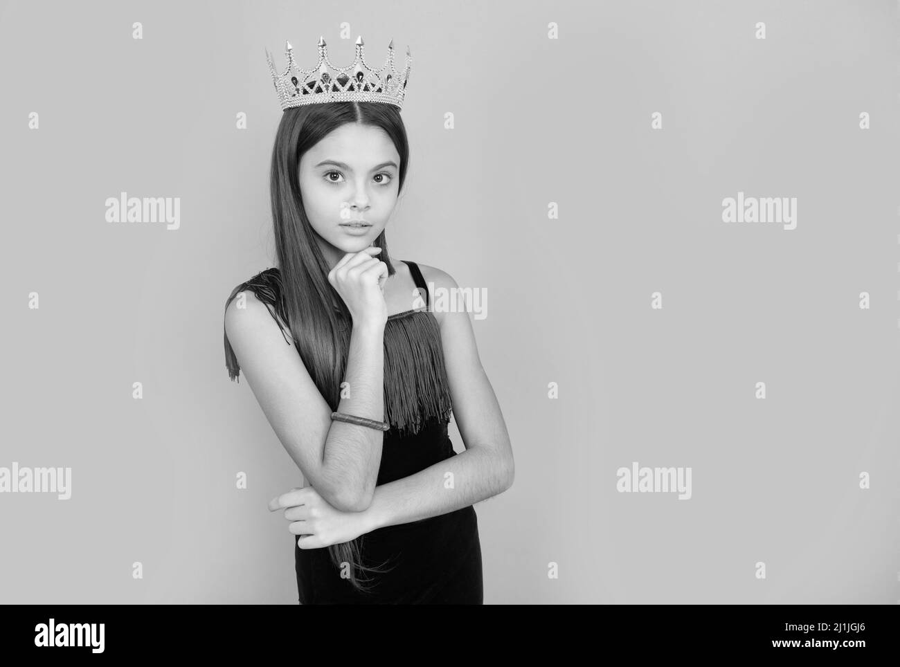 Ambitious girl wear luxury jewelry crown grey background copy space, big boss Stock Photo