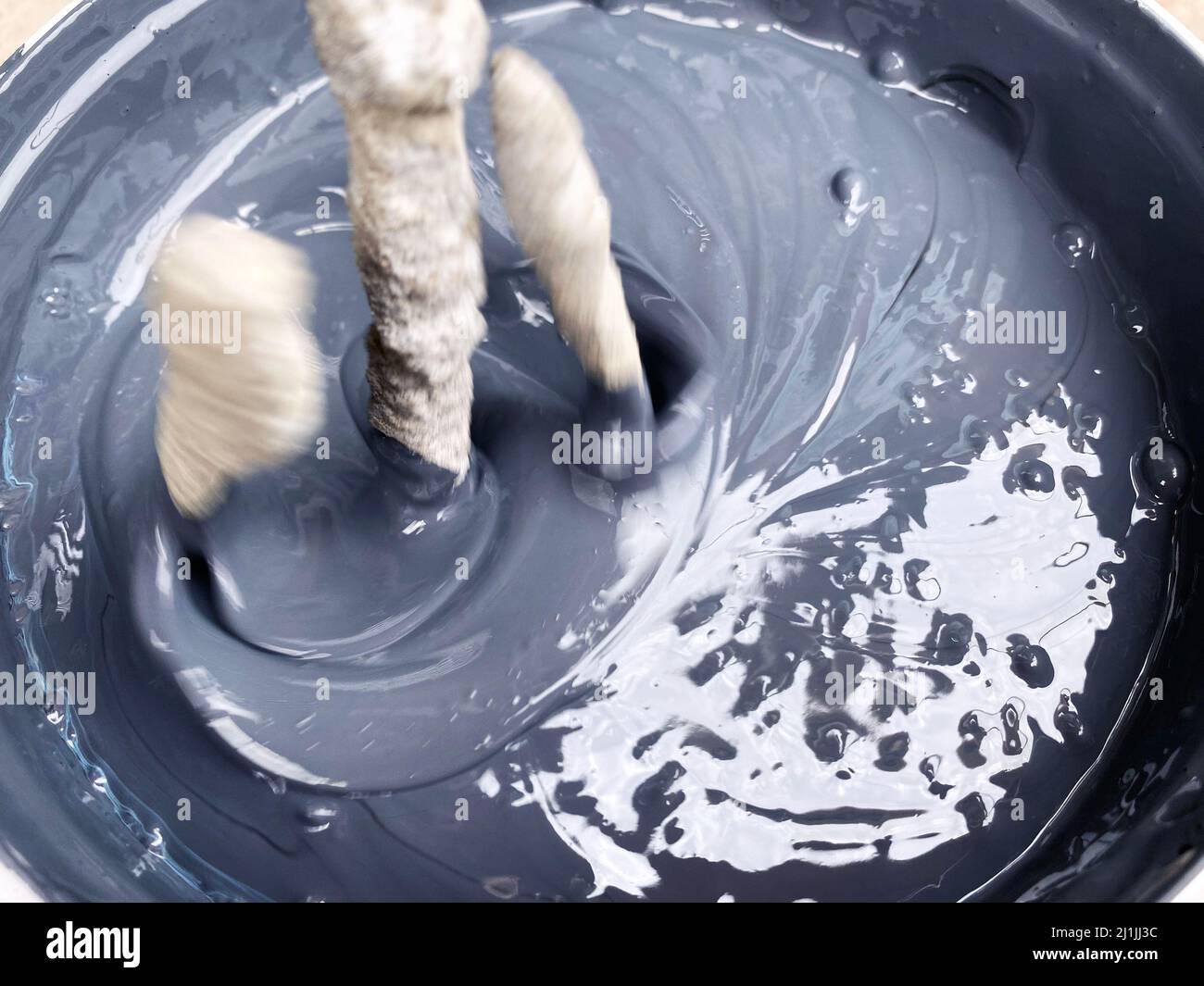 Building mixer for mixing paint. Mixing process Stock Photo Alamy