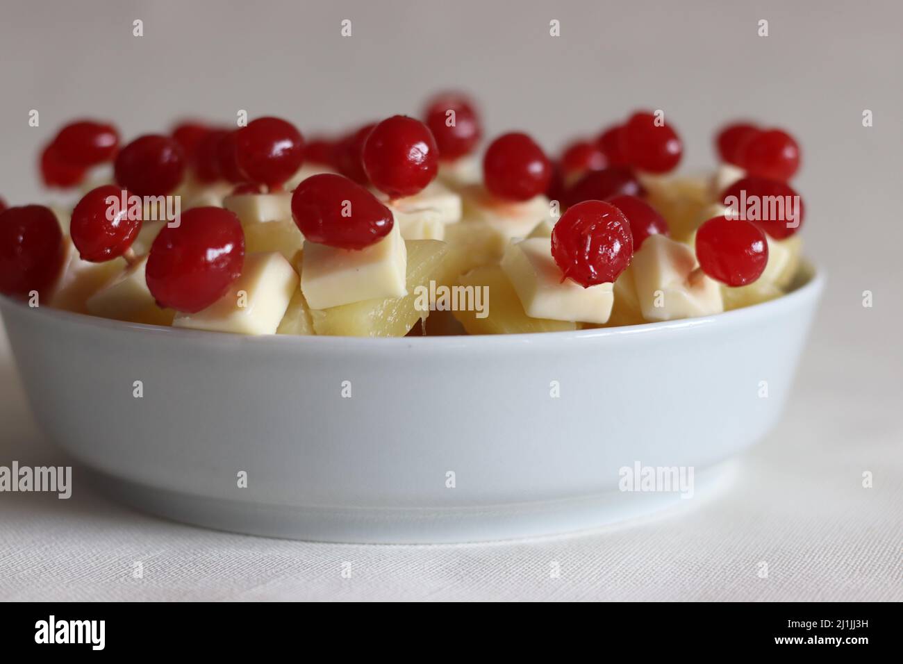 Cheese cherry pineapple. An easy to assemble, no cooking starter dish. Shot on white background Stock Photo