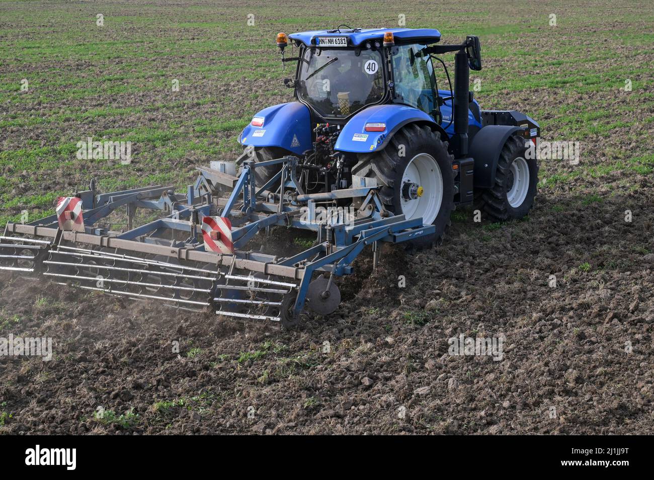 Germany, New Holland Tractor T6.180 with gas engine powered by BioMethane  gas CNG, working on field soil preperation / DEUTSCHLAND, Damnatz im  Wendland, neuer New Holland Traktor T6.180 mit Methanpower mit Gasmotor