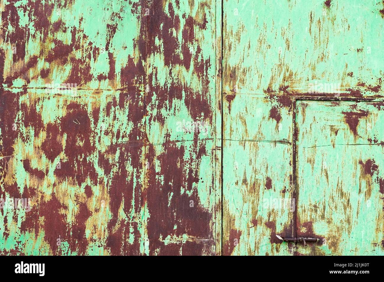 Rusty metal background with traces of gray paint. Stock Photo