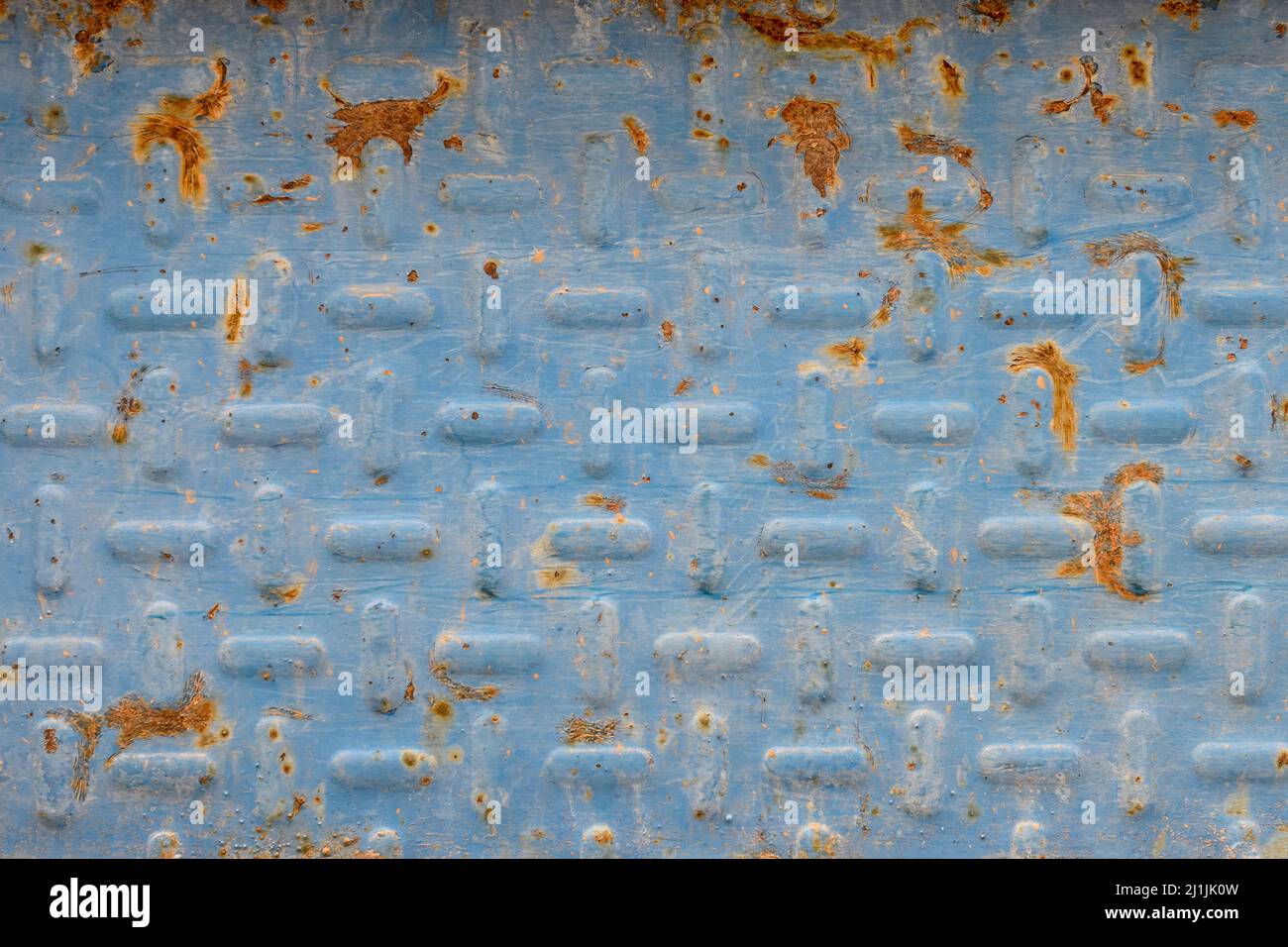 Rusty metal background with traces of gray paint. Stock Photo