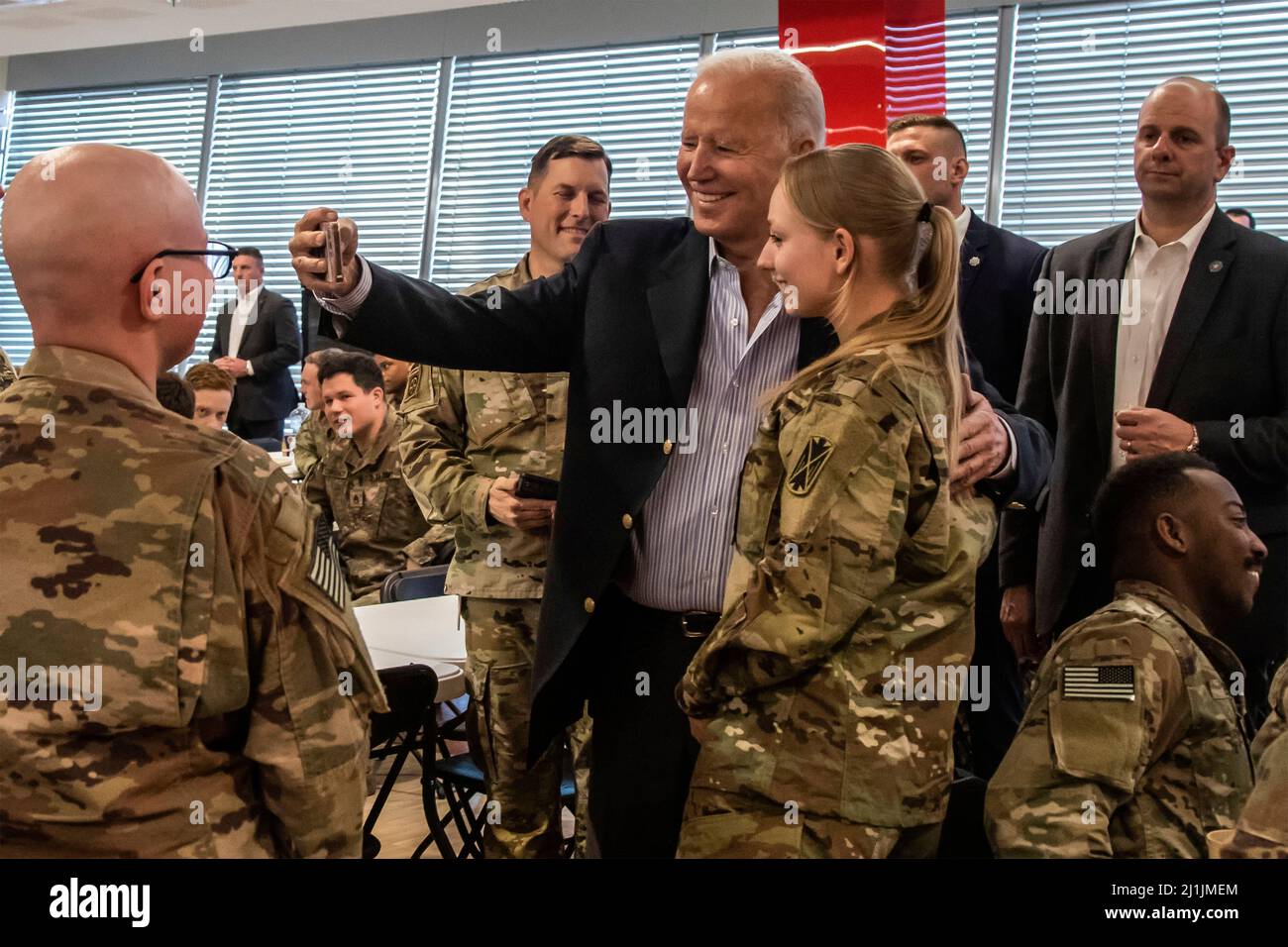 Jasionka, Poland. 25th Mar, 2022. President Joseph R. Biden Jr. visit and take selfies with Paratroopers in the 82nd Airborne Division, on March 25, 2022 in Rzeszów, Poland. The 82nd Airborne Division serves as the nation's Immediate Response Force, and maintains an ironclad commitment to our Allies and partners. (U.S. Army Photos by Sgt. Gerald Holman) Credit: Sgt. Gerald Holman/U.S. Army/Alamy Live News Stock Photo