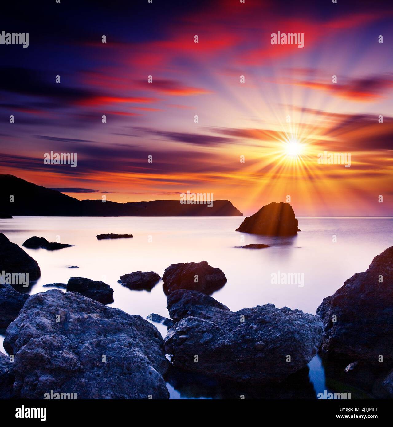 Beautiful summer sunset over the sea. HDR image Stock Photo - Alamy