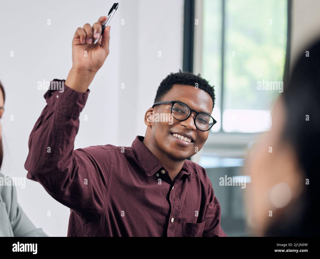 Young businessman raised arm hi-res stock photography and images - Alamy