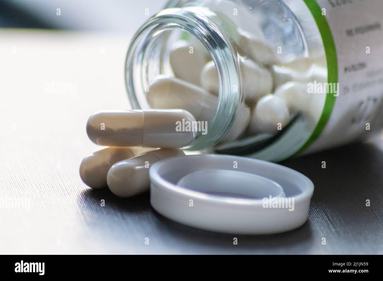 Many pills in medical jar for depression treatment show pandemic and quarantine disease and medical health care for drug addiction as medicine pack Stock Photo