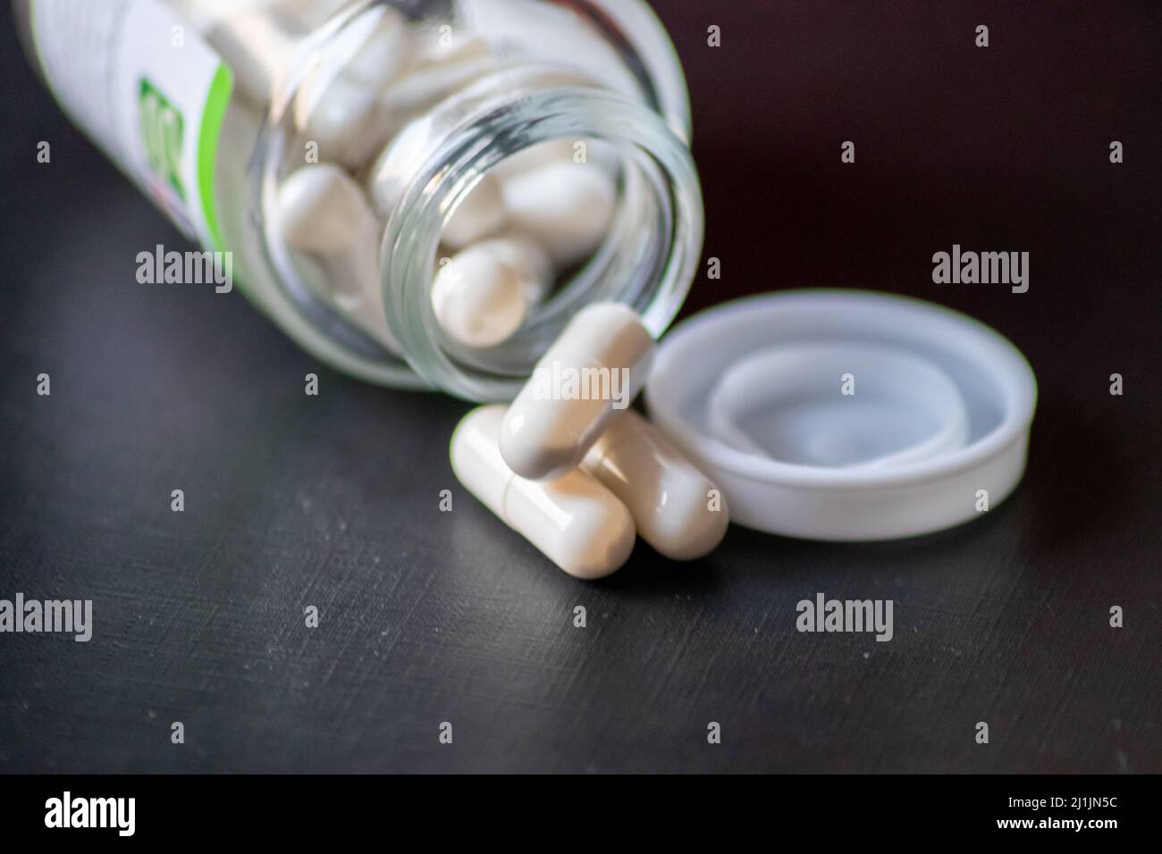 Many pills in medical jar for depression treatment show pandemic and quarantine disease and medical health care for drug addiction as medicine pack Stock Photo