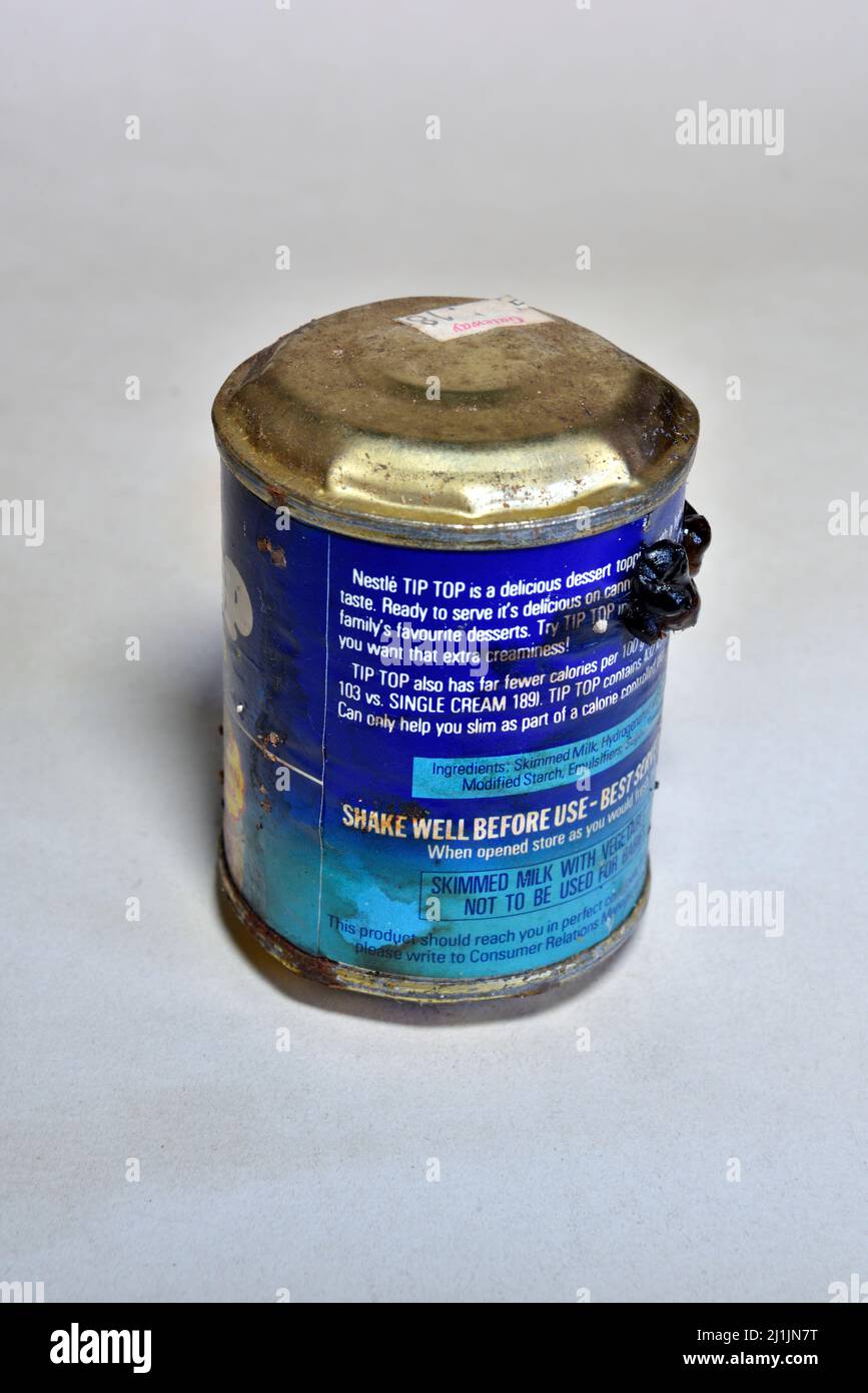 Out of date food tin with blown top and bottom and rust from storing too long Stock Photo