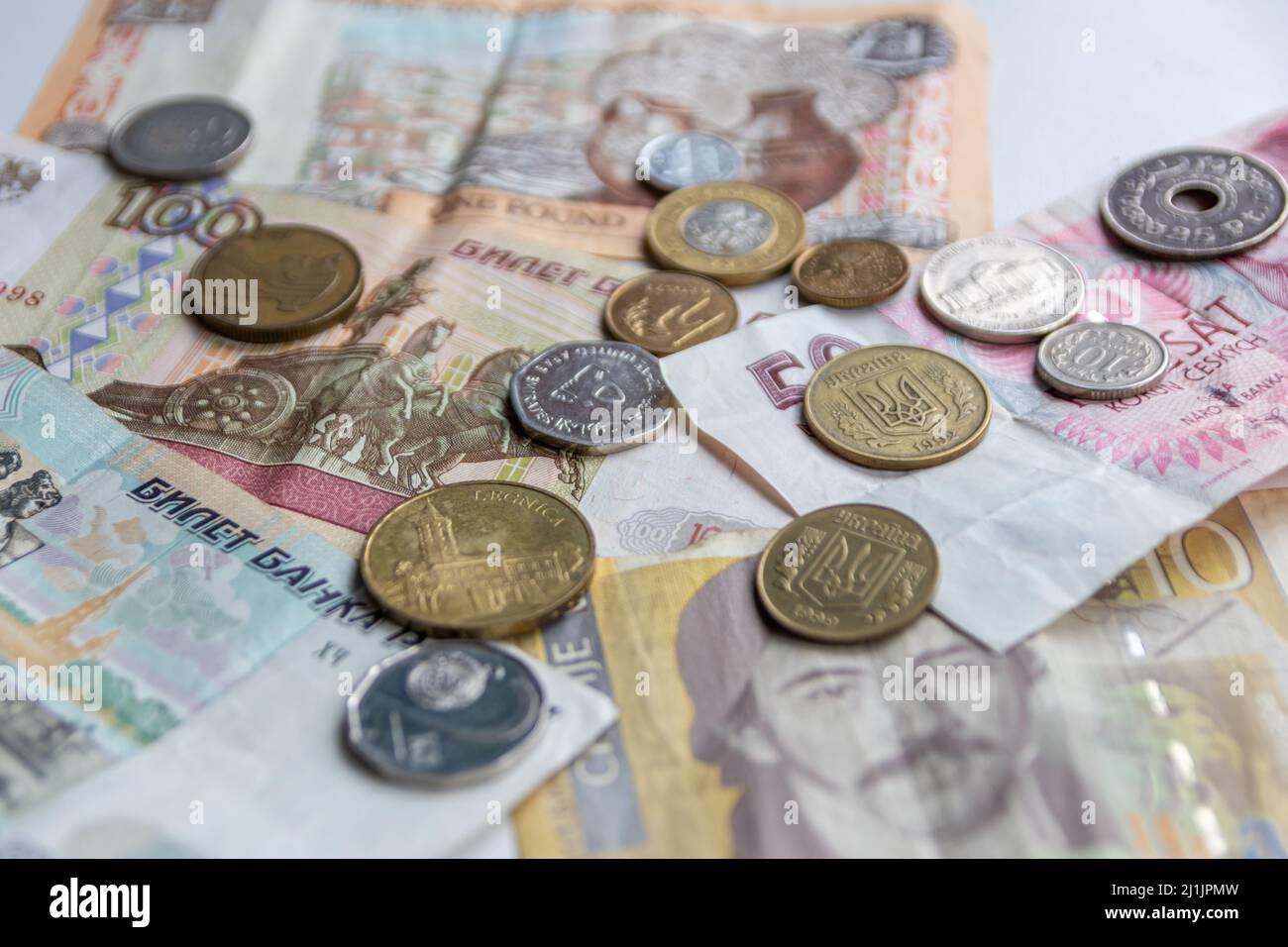 Variety of different bank notes and coins from various countries like euro, pound, emirates money, cyprus bank note and others represent international Stock Photo