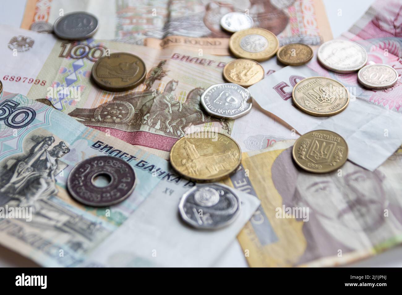 Variety of different bank notes and coins from various countries like euro, pound, emirates money, cyprus bank note and others represent international Stock Photo