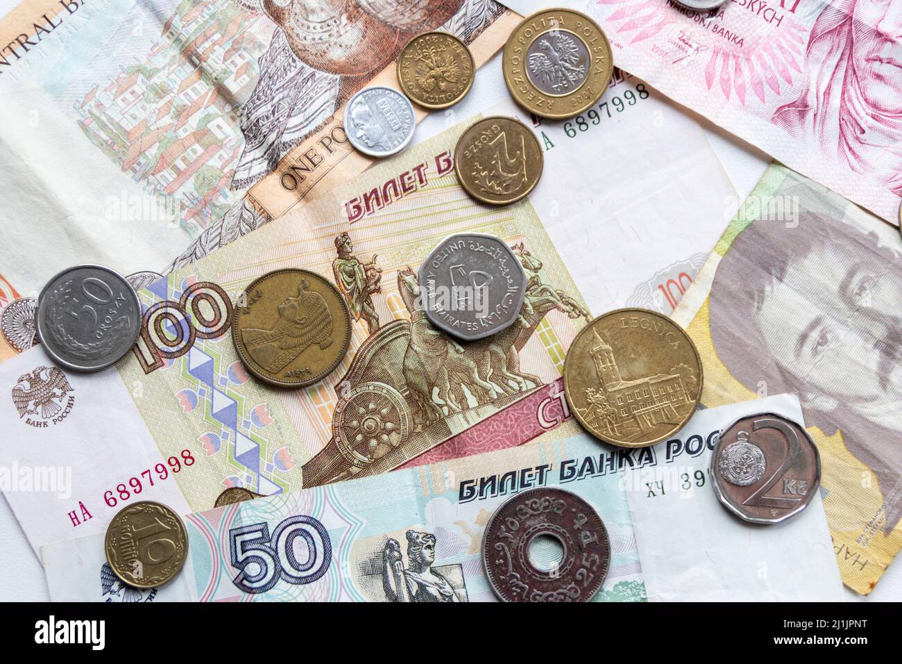 Variety of different bank notes and coins from various countries like euro, pound, emirates money, cyprus bank note and others represent international Stock Photo